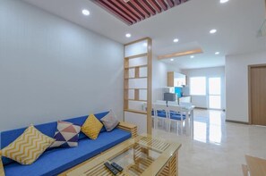Appartement Deluxe, 2 lits doubles | Aire de séjour | Téléviseur à écran plat