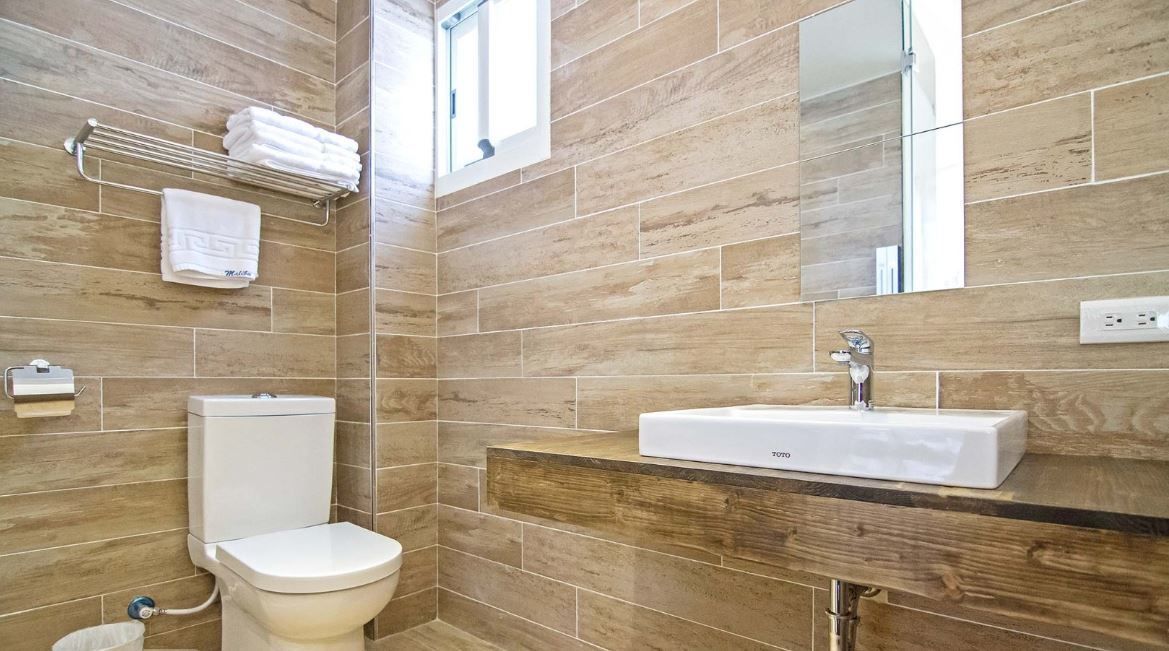 standard quadruple room | bathroom | slippers, towels