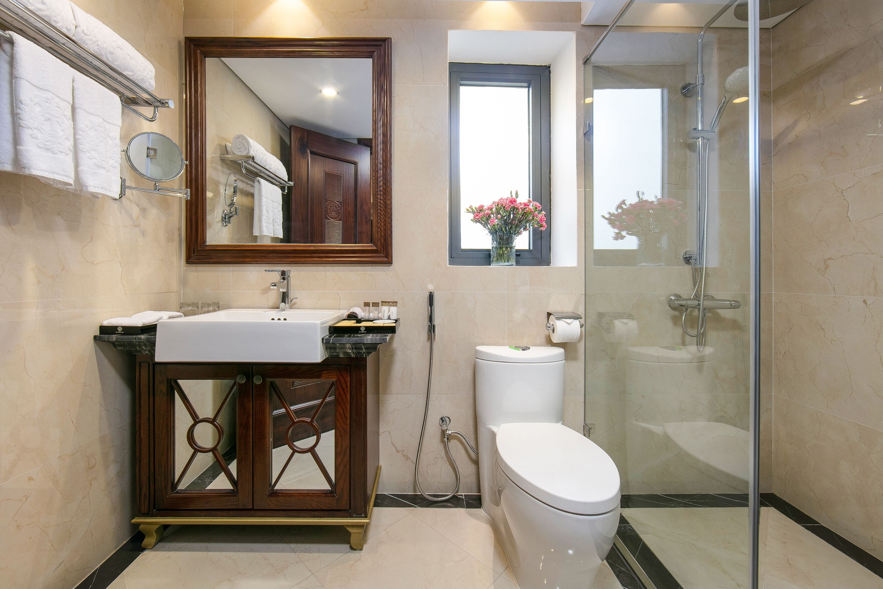 designer toiletries, hair dryer, bathrobes, slippers