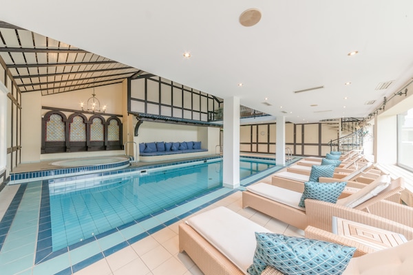 Indoor pool, open 8:00 AM to 8:00 PM, pool loungers