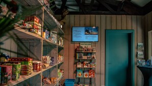 A bookstore with shelves stocked with books and a sign indicating bestsellers.