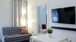 Apartment, 1 Bedroom | Living area | Flat-screen TV