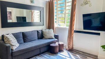 Apartment, 3 Bedrooms | Living area | Flat-screen TV