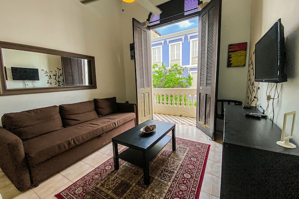 Apartment, 1 Bedroom | Living room | Flat-screen TV