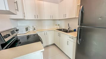 Fridge, microwave, stovetop, coffee/tea maker