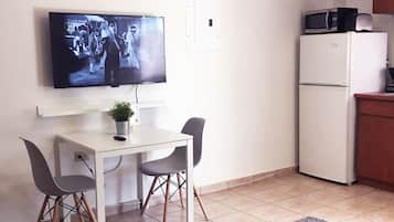 Apartment, 1 Bedroom | Living area | Flat-screen TV