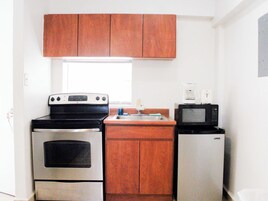Apartment, 1 Bedroom | Private kitchen | Fridge, microwave, stovetop, coffee/tea maker