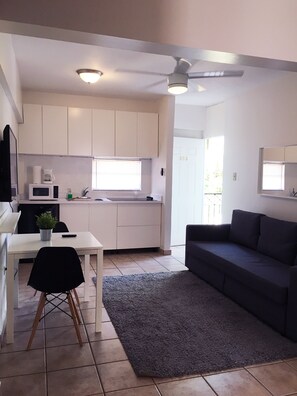 Apartment, 1 Bedroom | Living area | Flat-screen TV