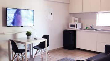 Apartment, 1 Bedroom | Living area | Flat-screen TV