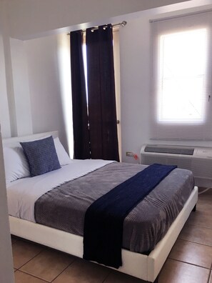 Apartment, 1 Bedroom | 1 bedroom, desk, iron/ironing board, free WiFi - Boulevard 401 (Mayagüez)