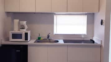 Apartment, 1 Bedroom | Private kitchen | Fridge, microwave, stovetop, coffee/tea maker