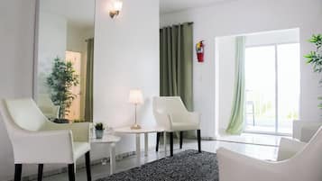 Chambre Deluxe | Coin séjour