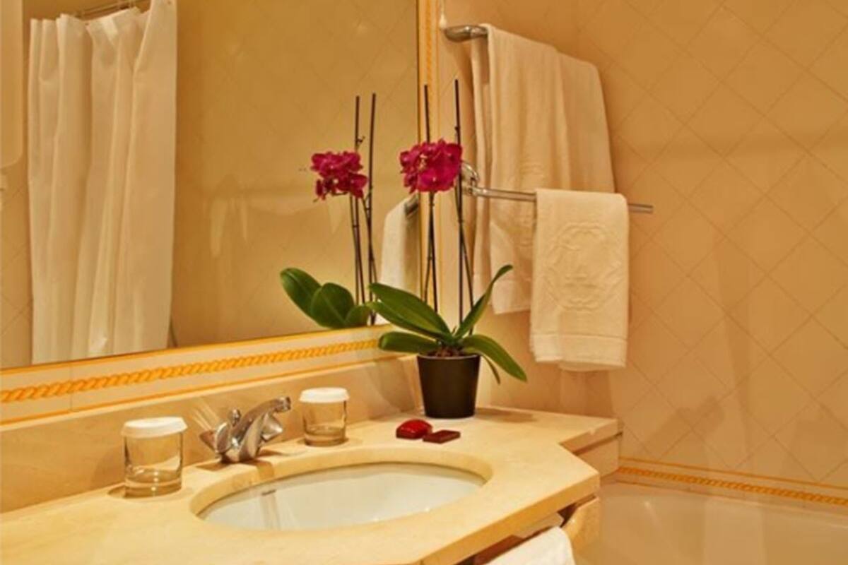 bathtub, deep-soaking bathtub, hair dryer, bathrobes