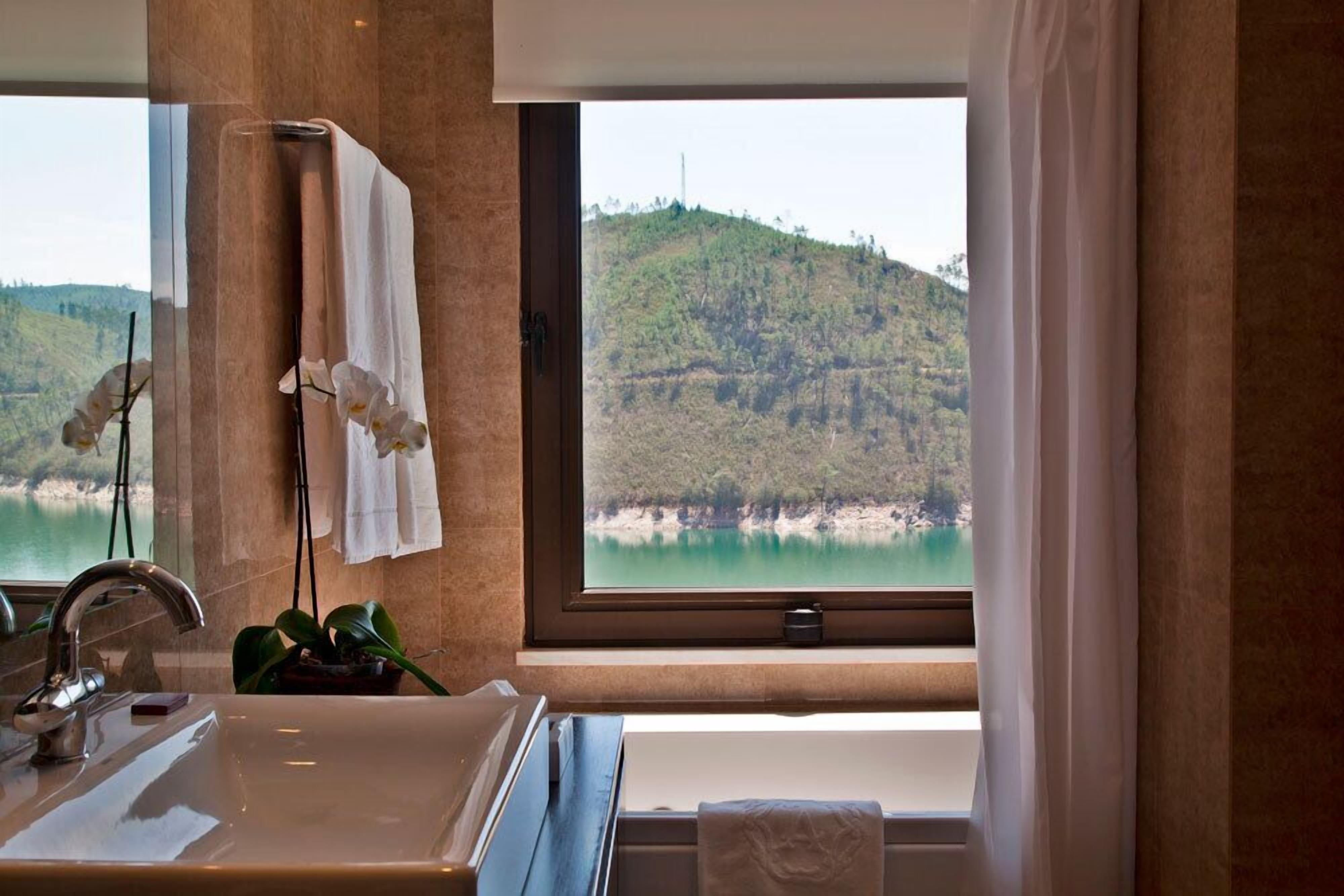 suite | bathroom | bathtub, deep-soaking bathtub, hair dryer, bathrobes