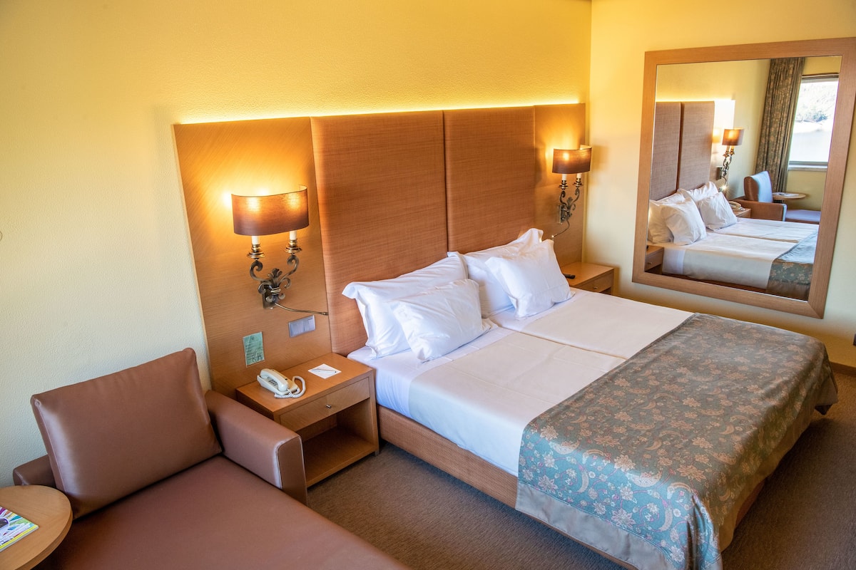 double room, garden view | minibar, in-room safe, desk, blackout curtains