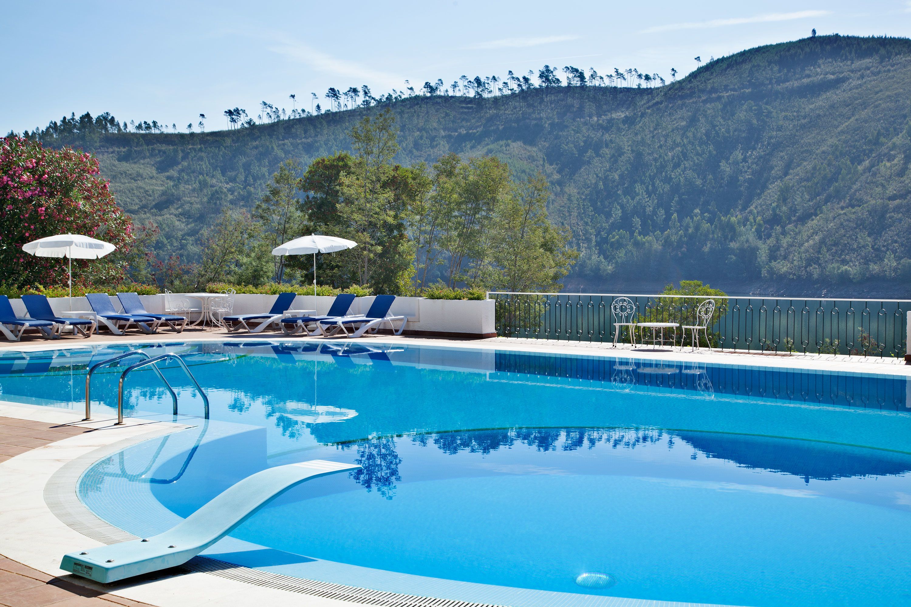 outdoor pool, pool umbrellas, pool loungers