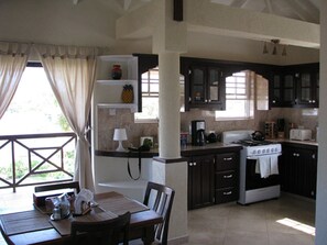 Deluxe Apartment, 4 Bedrooms, Balcony | Private kitchen | Full-size fridge, microwave, oven, stovetop