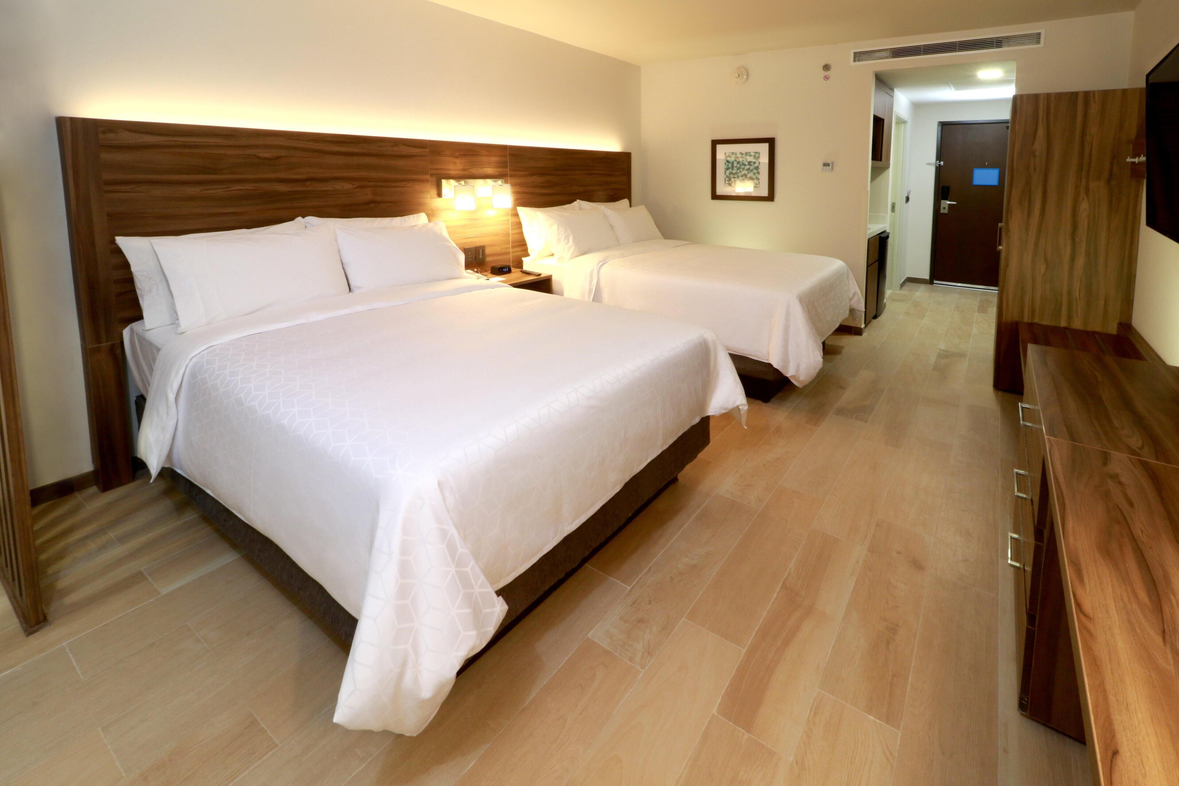 Premium bedding, down comforters, Tempur-Pedic beds, in-room safe