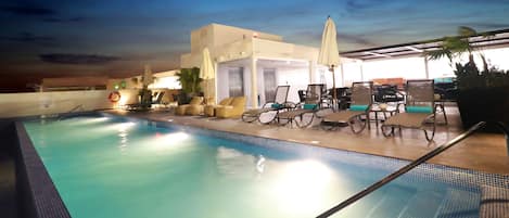 Outdoor pool, open 8 AM to 10 PM, pool umbrellas, pool loungers