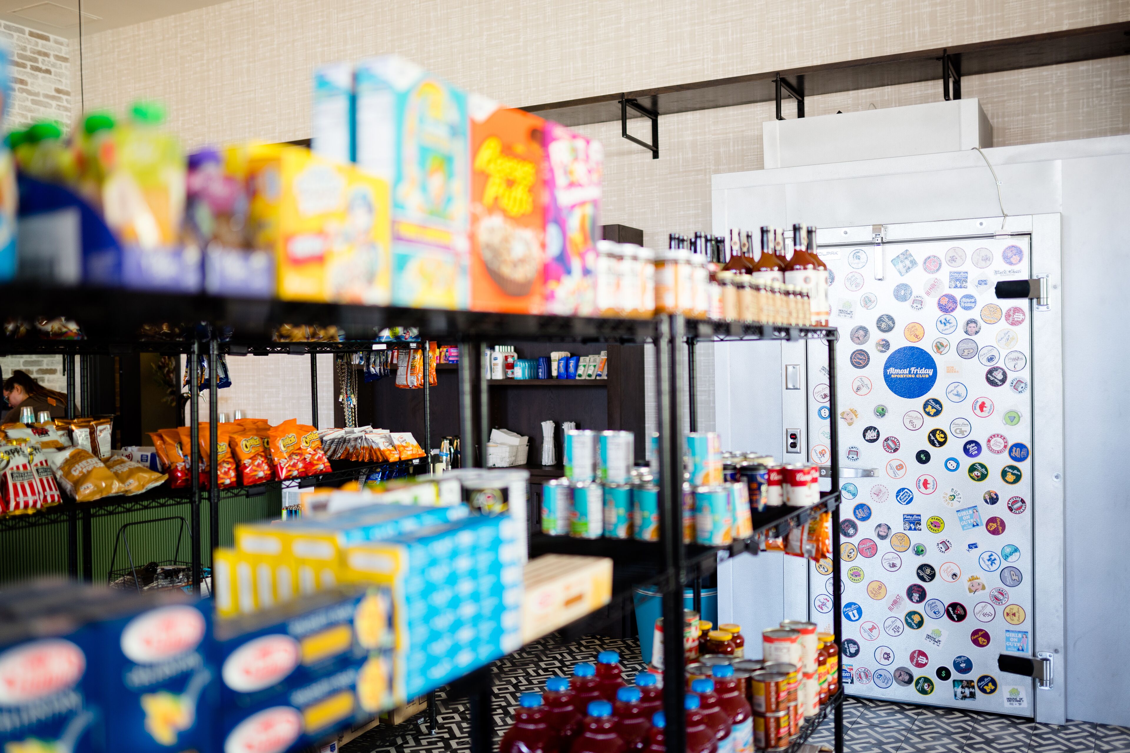 A grocery store with shelves stocked with snacks, beverages, and packaged goods.