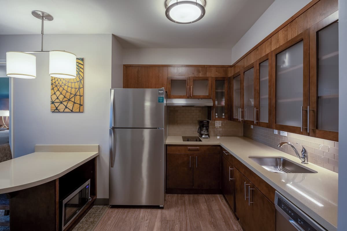 full-sized fridge, microwave, stovetop, dishwasher
