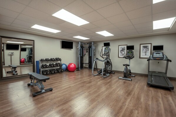 A gym with exercise equipment, a bench, dumbbells, and exercise balls. - Staybridge Suites Phoenix East - Gilbert by IHG (Gilbert)