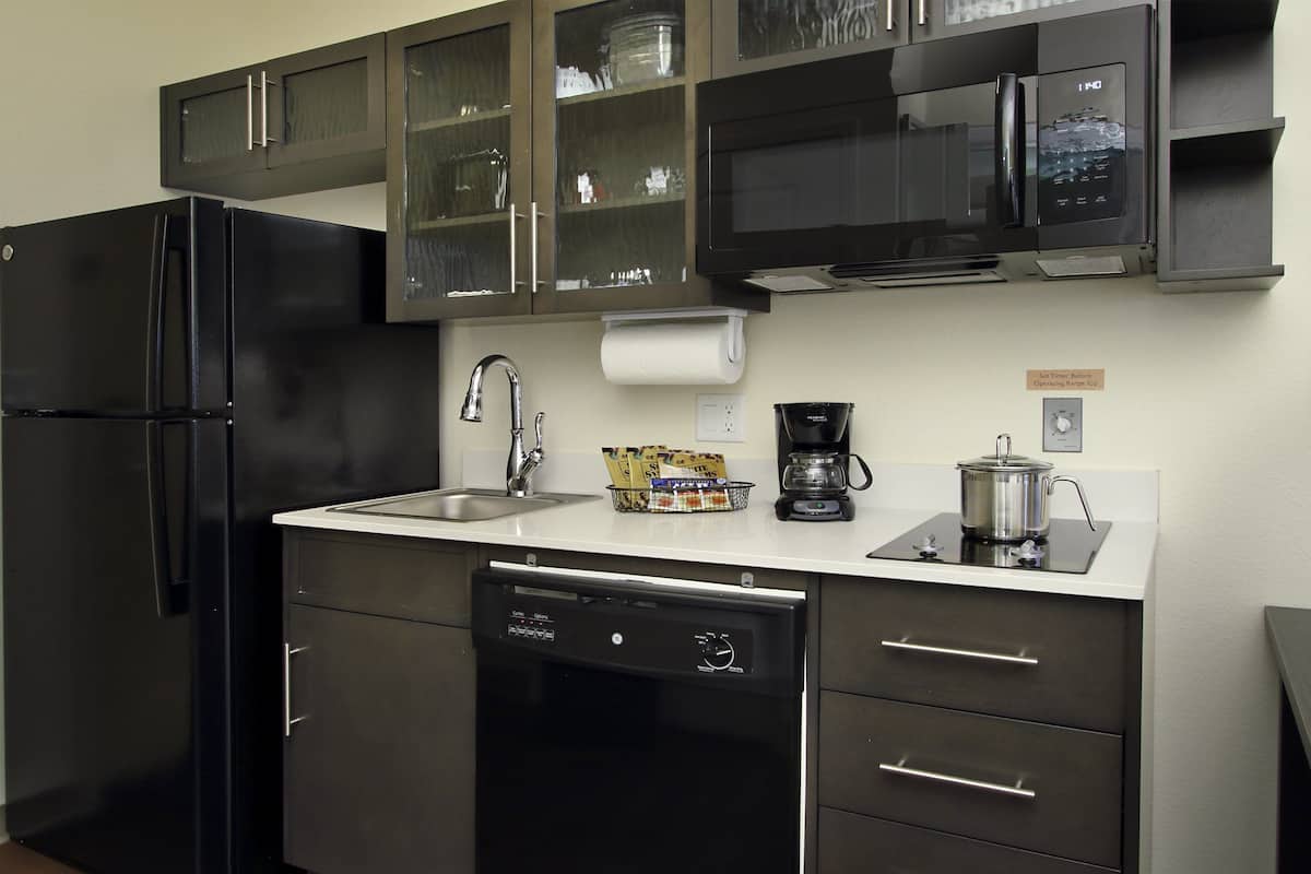 full-sized fridge, microwave, stovetop, dishwasher