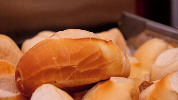 A basket of various bread rolls.