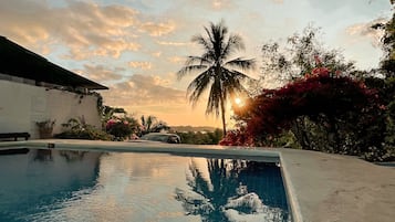 Outdoor pool, open 7 AM to 10 PM, pool loungers