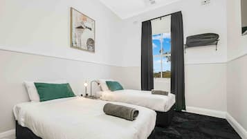 Standard Twin Room, Shared Bathroom | Blackout drapes, iron/ironing board, free WiFi, bed sheets