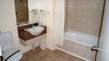 Executive Studio, Non Smoking | Bathroom | Deep-soaking bathtub, rainfall showerhead, free toiletries, hair dryer