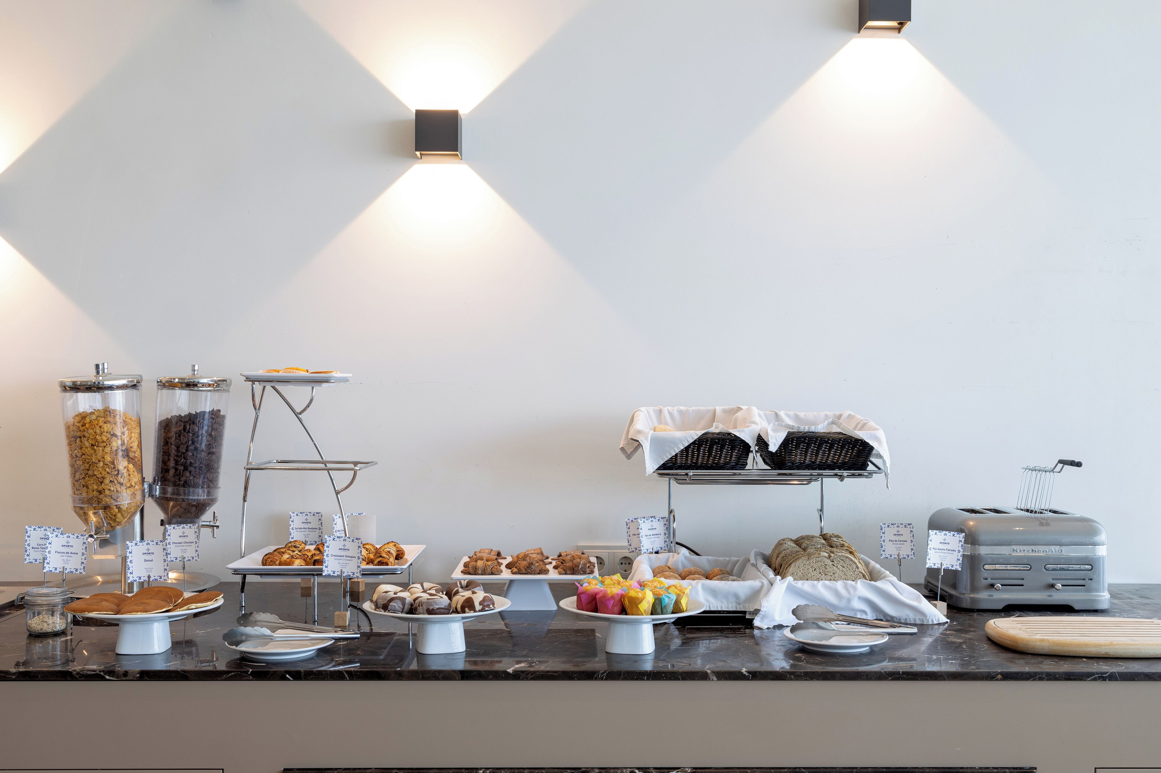 A breakfast buffet with various food items and a toaster.