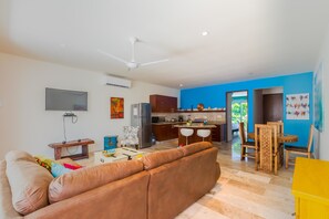 Condo | Living room | TV, DVD player, books - Estrella Del Mar One Bedroom 102 (Isla Mujeres)
