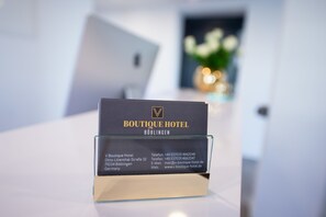 A business card for Boutique Hotel in Böblingen, Germany, with contact details. - V Boutique Hotel (Boeblingen)