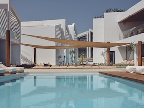 5 outdoor pools, open 9 AM to 7 PM, pool umbrellas, pool loungers