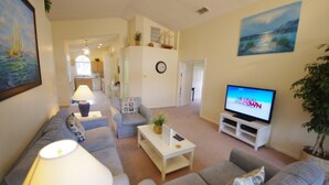 A living room with a sofa, armchairs, a coffee table, and a television. - Ly53807 - Indian Ridge - 3 Bed 2 Baths Villa (Kissimmee)