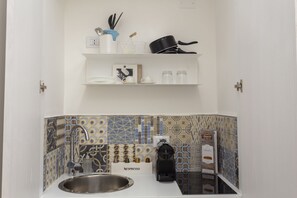 Fridge, stovetop, espresso maker, cookware/dishes/utensils
