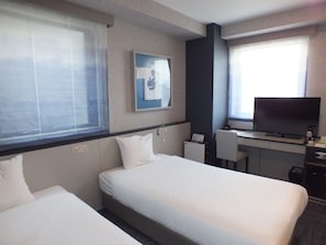 Chambre avec lits jumeaux, non-fumeurs | Coffres-forts dans les chambres, rideaux occultants, Wi-Fi gratuit