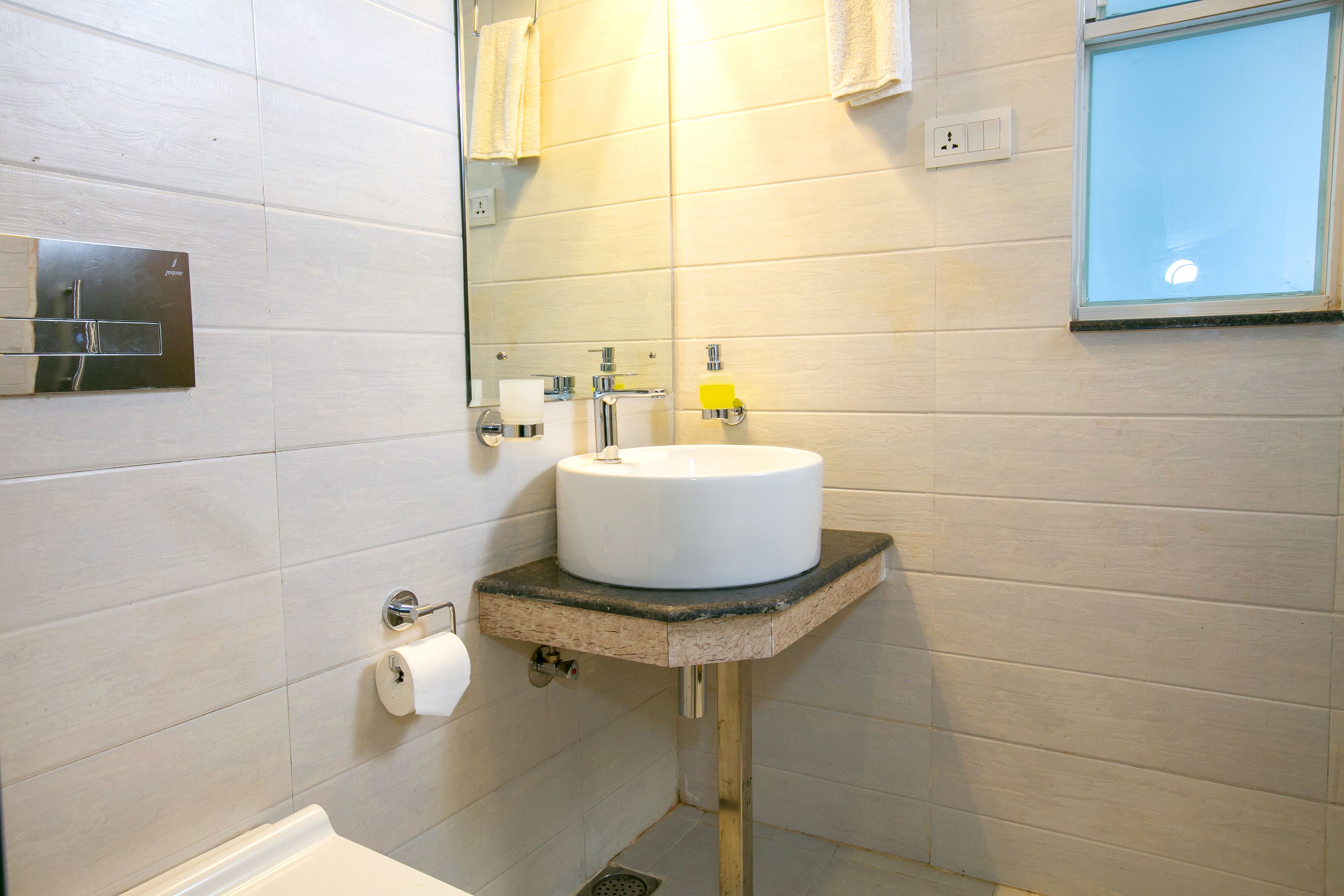 shower, designer toiletries, hair dryer, slippers