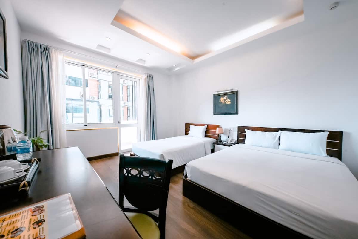 Deluxe Triple Room, City View | Hypo-allergenic bedding, down comforters, minibar, in-room safe
