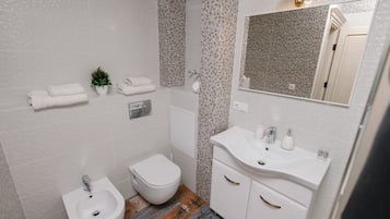 Exclusive Apartment, Multiple Beds, Non Smoking | Bathroom | Free toiletries, hair dryer, bathrobes, slippers
