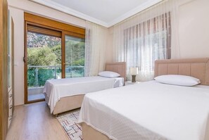2 bedrooms, blackout drapes, soundproofing, iron/ironing board