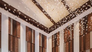 A spacious lobby with a reception desk, a seating area, and a decorative ceiling. - Pullman Changbaishan Resort (Baishan)