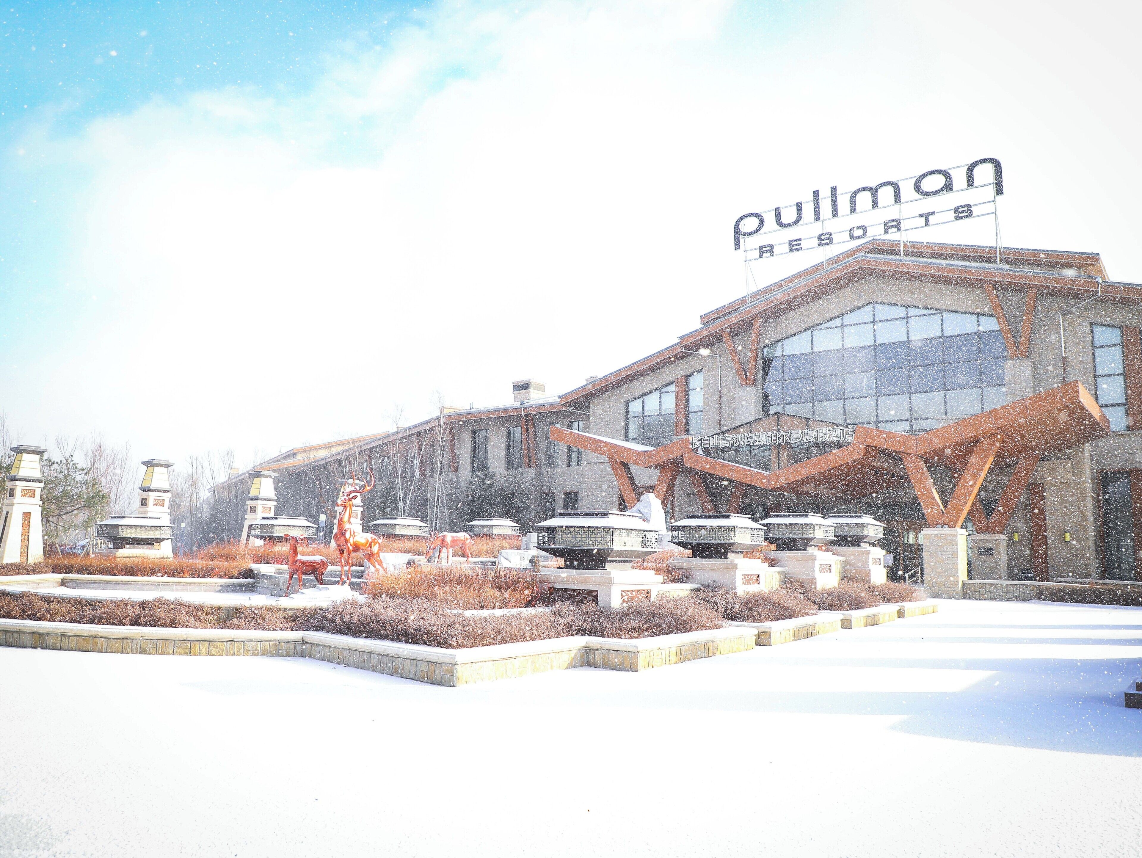 A building with a sign reading "Pullman Resorts."