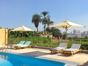 Outdoor pool, open 6:00 AM to 6:00 PM, pool umbrellas, sun loungers - Jewel Howard Carter Hotel (Luxor)