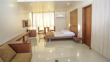 Executive Double Room, 1 King Bed, Accessible | Living room | Flat-screen TV