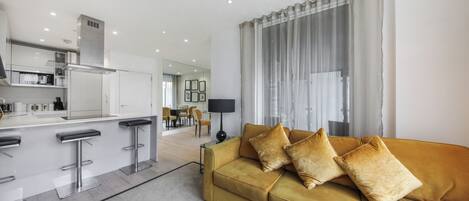 Executive Apartment, 2 Double Beds | Living area | Flat-screen TV