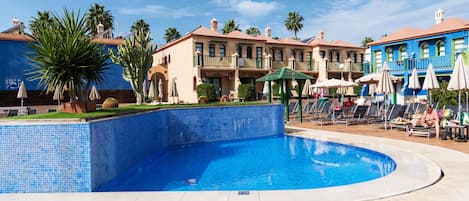 Outdoor pool, open 10 AM to 6 PM, pool umbrellas, sun loungers