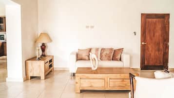 Standard Room, Ocean View | Living area | TV