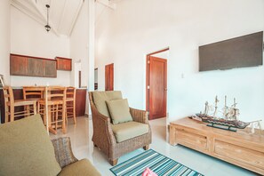 Standard Room, Ocean View | Living area | TV